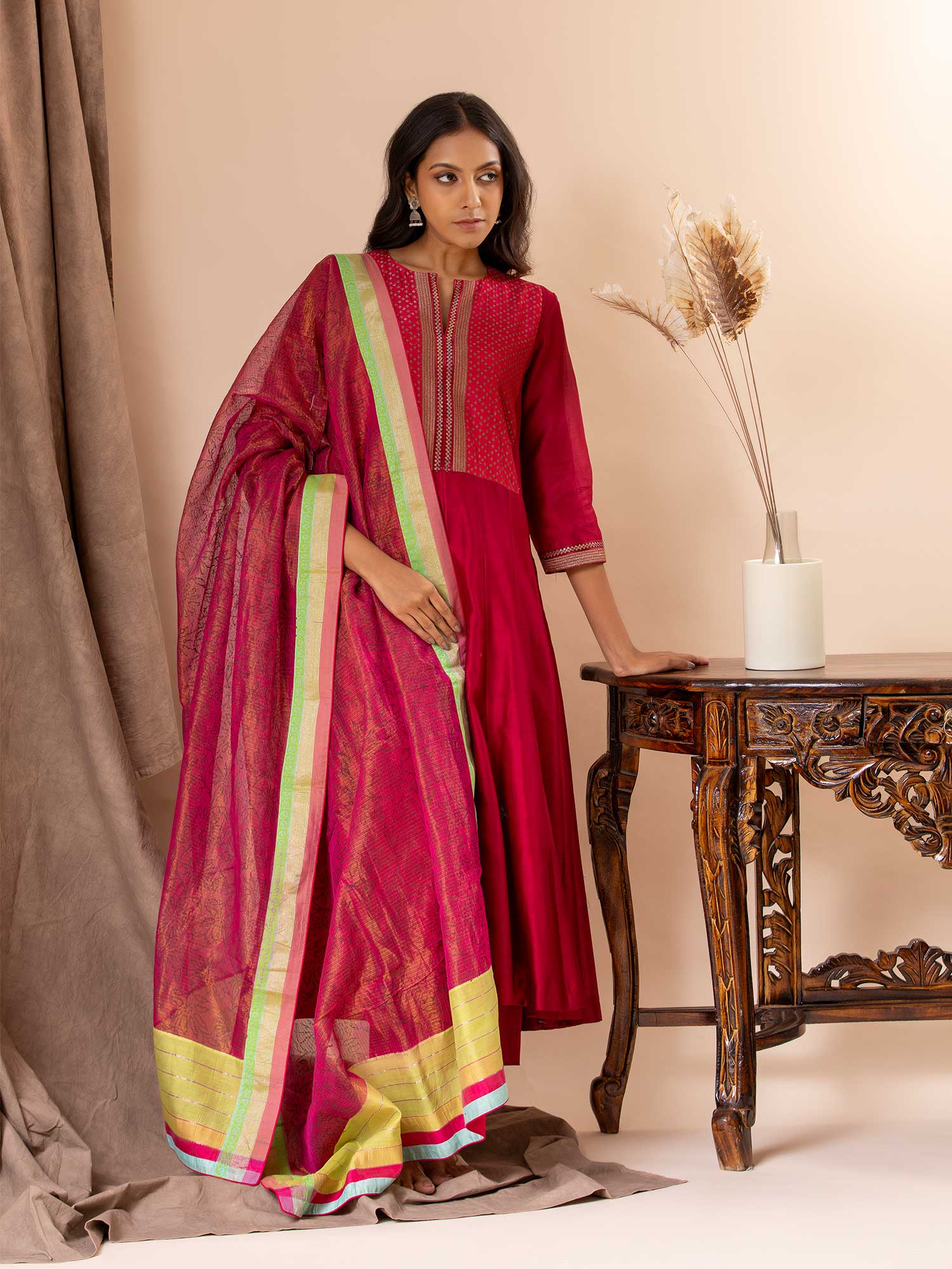 Chanderi kali top in cherry red paired with a tissue-printed Kota dupatta and lycra pants